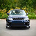 Load image into Gallery viewer, Navy blue Range Rover Sport 2018–2022 with Enkahnz LM style bodykit installed, seen from the front angle on the road.
