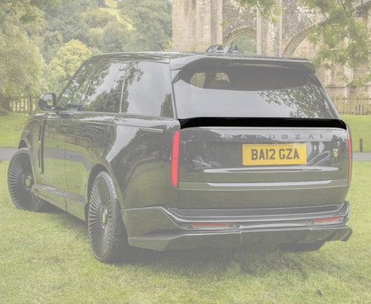 Quarter Rear View of a Black Range Rover Mid Boot Spoiler with an opaque white background of the rest of the car on the green grass.