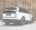 Load image into Gallery viewer, Rear Quarter View of a Gloss Black and White Range Rover Vogue L460 2022+ Mid Boot spoiler in an opaque white warehouse setting with Enkahnz Branding.
