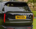 Load image into Gallery viewer, Quarter Rear View of a Close up of the Black Range Rover and the spoiler in Barugzai Branding.
