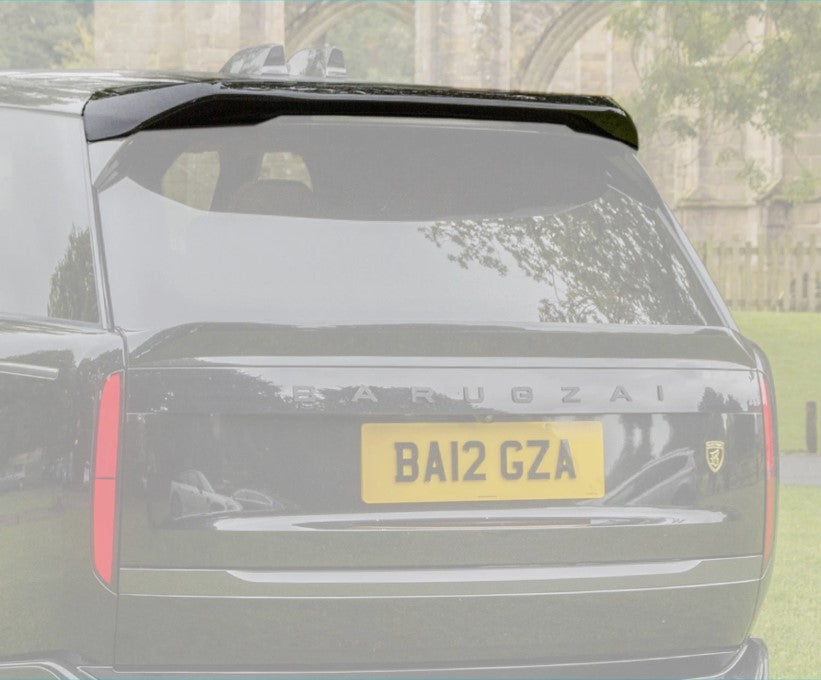 Close up of the spoiler of a Range Rover Vogue 2022+ gloss black car with the rest of the background in opaque white. 