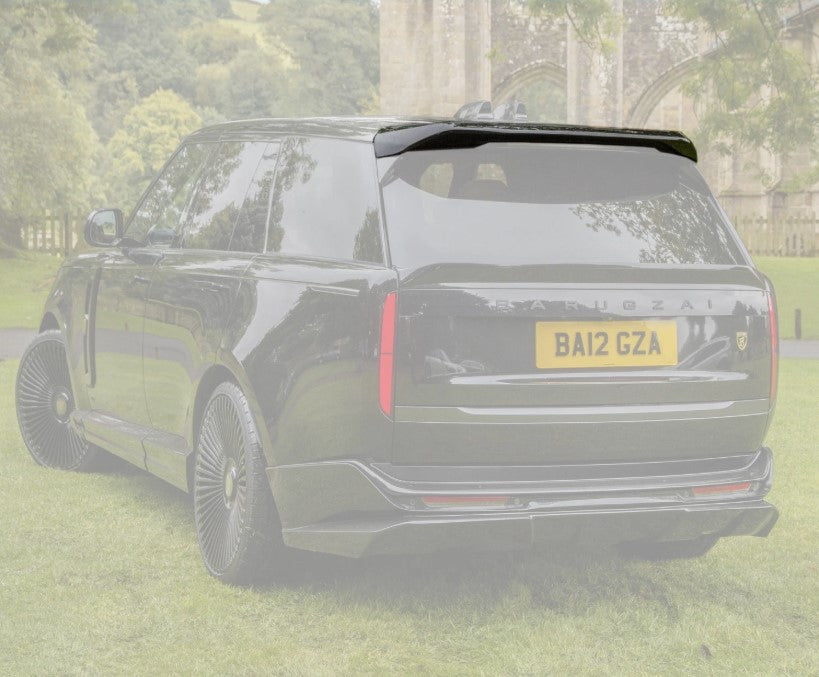 Quarter Rear View of a Black Range Rover Spoiler with an opaque white background of the rest of the car on the green grass. 