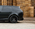 Load image into Gallery viewer, Side View of a Gloss Black Range Rover Vogue 2022+ L460 in a warehouse setting with Enkahnz.
