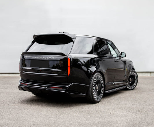 Rear Quarter View of a Black Range Range Rover Vogue 2022+ on a grey background with a Barugzai Roof Spoiler.