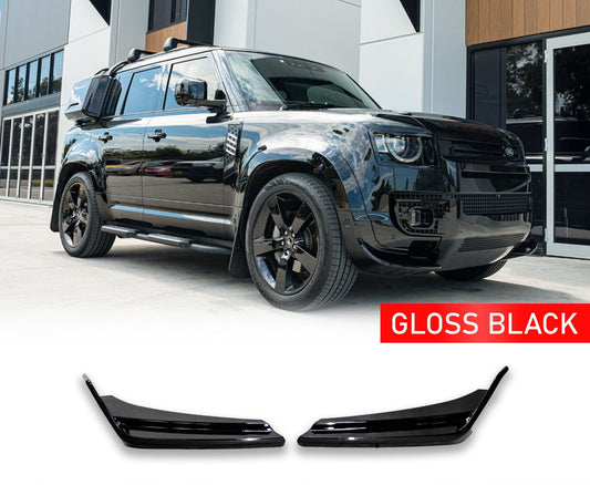 Black Land Rover Defender L663 90 / 110 / 130 (2020+) with gloss black car in front of a building, with enkahnz branding. The Front canards on the bottom with a white background. 