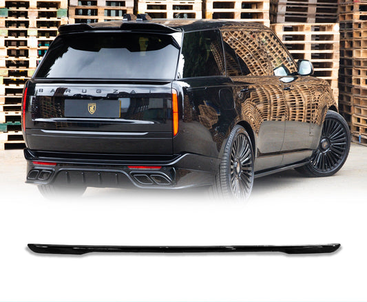 Rear Quarter Close up of a gloss black range rover vogue L460 2022+ in a warehouse background with the mid boot spoiler placed in the bottom in front of a white background with Barugzai Branding.
