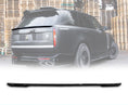Load image into Gallery viewer, Rear Quarter Close up of a gloss black range rover vogue L460 2022+ roof spoiler in an opaque white warehouse background with the mid boot spoiler placed in the bottom in front of a white background with Barugzai Branding.
