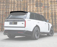 Load image into Gallery viewer, White Range Rover with a roof spoiler in focus with a white background front of stacked wooden pallets with Enkahnz Bradford.
