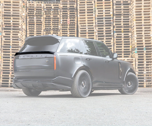 Rear Quarter View of a Gloss Black Range Rover Vogue L460 2022+ Mid Boot Spoiler in an opaque white  warehouse setting with Enkahnz Branding.