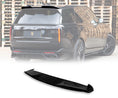 Load image into Gallery viewer, Close up of a gloss black range rover vogue L460 2022+ roof spoiler in an opaque white warehouse background with the roof spoiler placed in the bottom in front of a white background with Barugzai Branding.
