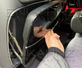 Load image into Gallery viewer, Close Up of Rear Quarter view of the Rear Seat in a G-Wagon W464-W465 with the item in the bottom. 
