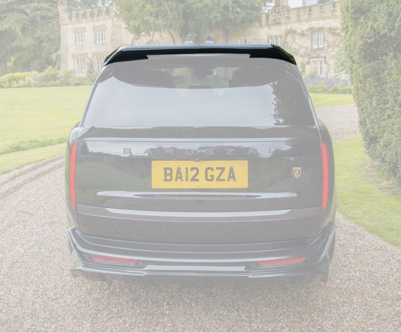 Rear View of the spoiler of a black range rover vogue L460 2022+ at the entrance of the house, with the rest of the background and car in opaque white