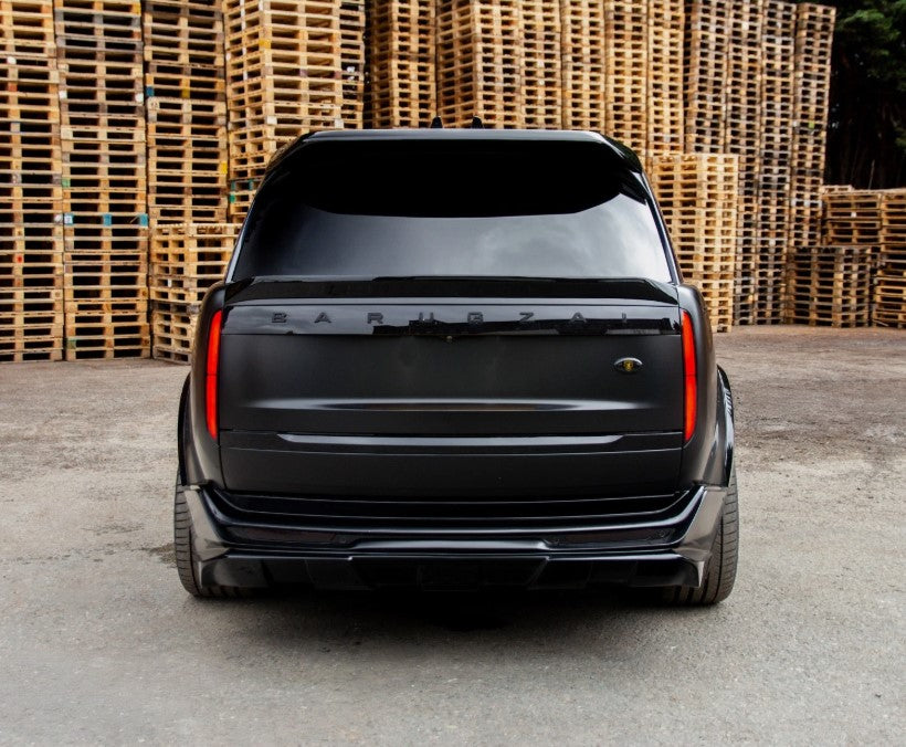 Rear View of a Gloss Black Range Rover Vogue 2022+ in a warehouse setting with Enkahnz Branding.