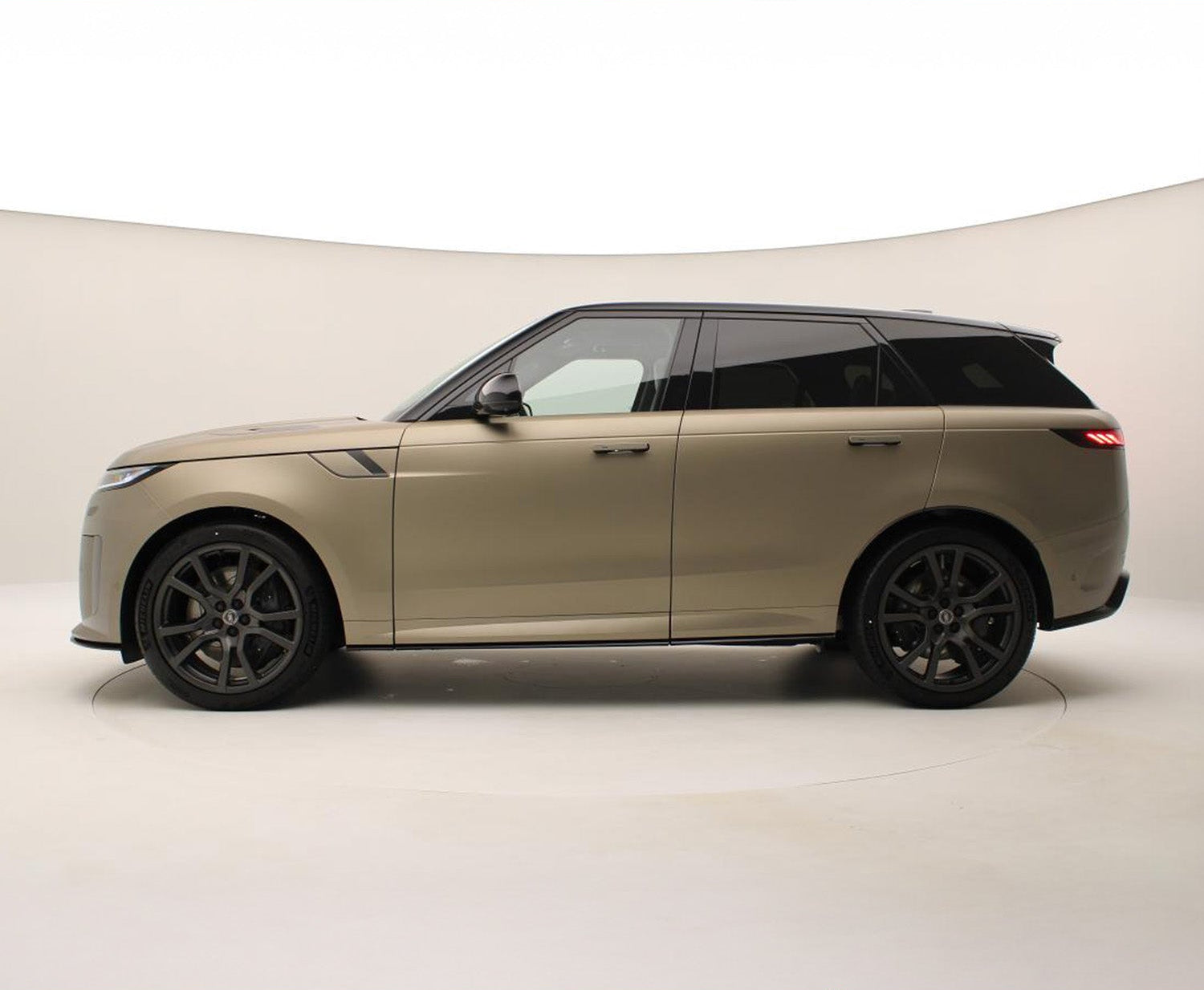 Side View of a Beige Range Rover Sport with SV Style Bodykit on a beige background.