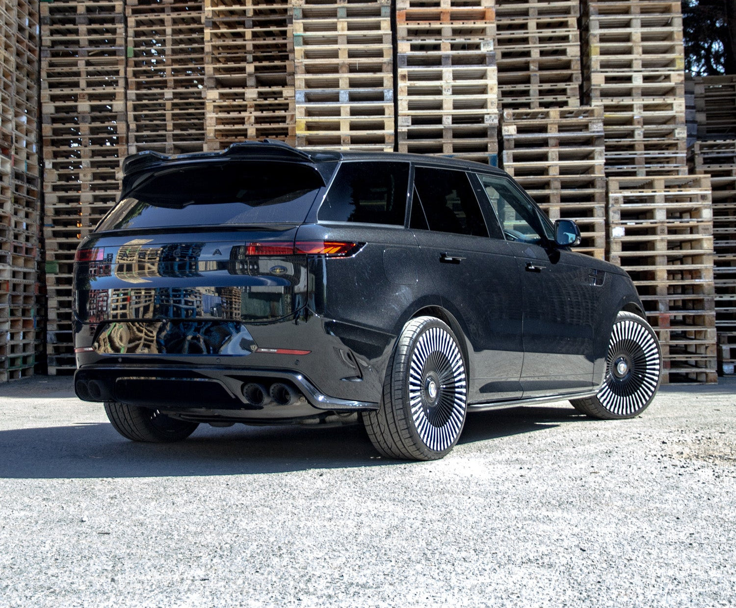 Rear Quarter Dutch Angle SV Style Black Back Bumper for Range Rover Sport 2023+ with Enkahnz branding and product shots in the bottom.