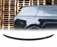 Load image into Gallery viewer, Side view of a Range Rover L460 Vogue Gloss Black with a Mid Boot Spoiler with wooden pallets in the background and the rear roof spoiler placed in front of a white background in the bottom.
