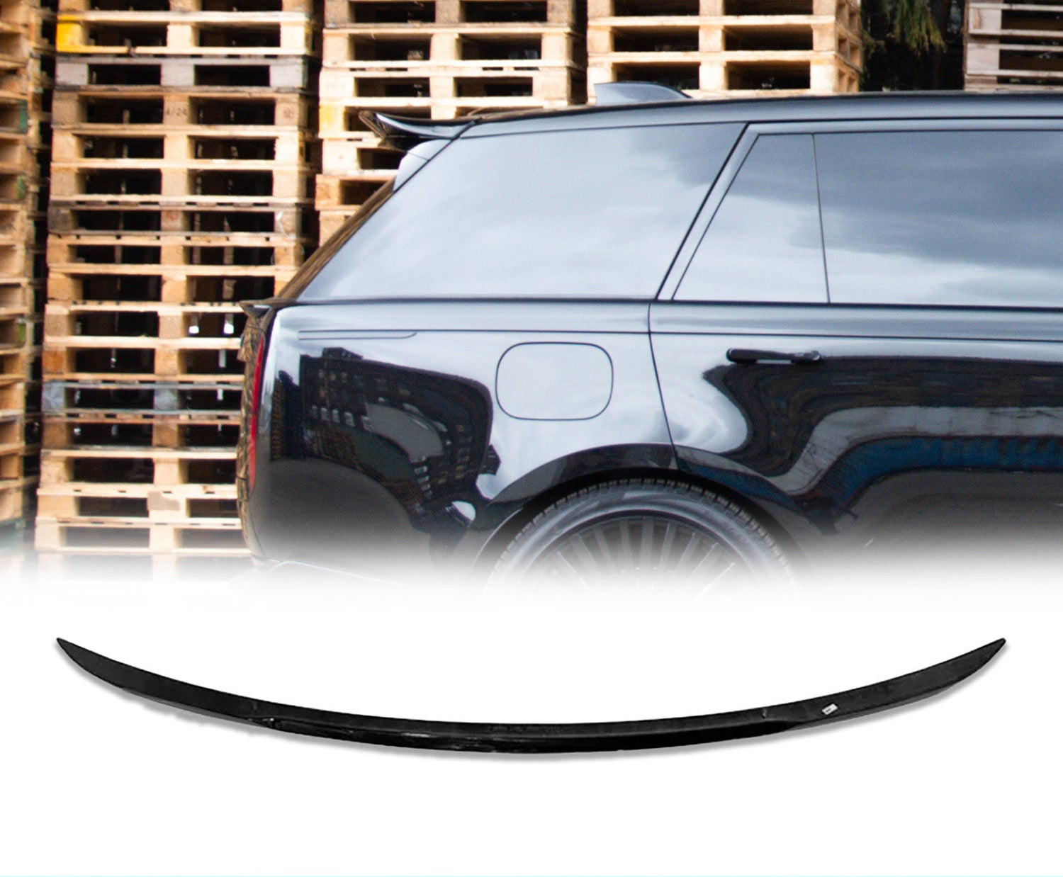 Side view of a Range Rover L460 Vogue Gloss Black with a Mid Boot Spoiler with wooden pallets in the background and the rear roof spoiler placed in front of a white background in the bottom.