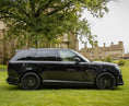 Load image into Gallery viewer, Side View of the Black Range Rover Vogue L460 2022+ on the green grass with Barugzai Branding. 
