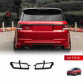 Load image into Gallery viewer, Rear angle view of a red Range Rover Sport fitted with the ENKAHNZ LM Style body kit, showcasing black LM Style exhaust tips at the bottom, set in a park with greenery.
