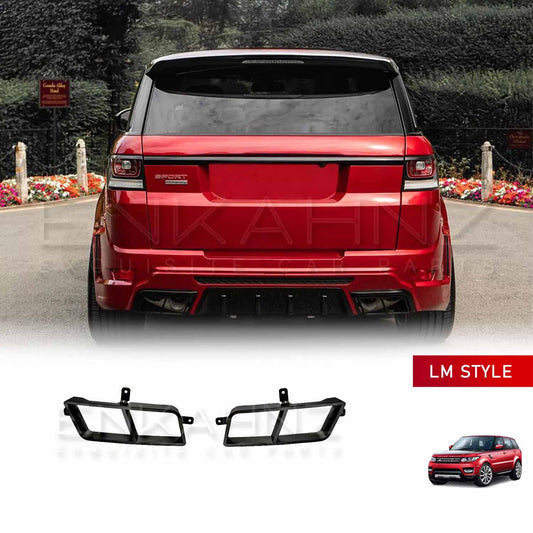 Rear angle view of a red Range Rover Sport fitted with the ENKAHNZ LM Style body kit, showcasing black LM Style exhaust tips at the bottom, set in a park with greenery.