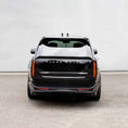 Load image into Gallery viewer, Rear angle view of Range Rover Vogue L460 fitted with gloss black Barugzai Nebula bodykit

