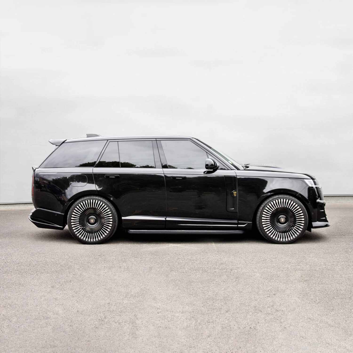 Side profile angle of Range Rover Vogue L460 with complete Barugzai Nebula bodykit in gloss black