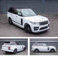 Load image into Gallery viewer, White Range Rover L405 2018-2021, fitted with SVO style bodykit with black accents on a gray, parked outside of Enkahnz HQ. Fitted with Barugzai Casanova 22" alloy wheels in Gloss black
