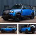 Load image into Gallery viewer, Satin Blue Land Rover Defender 110 L663 2020, parked outside a warehouse. Fitted with Barugzai Shuracan 22" alloy wheels in Gloss Black 
