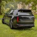Load image into Gallery viewer, Black Range Rover L460 2022, fitted with Barugzai Nebula bodykit, shown rear quarter angle, shot outside a histrorical landmark with greenery. Fitted with Barugzai Vortex Forged 24" alloy wheels in Gloss Black Polished
