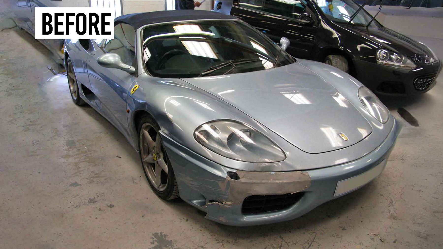 Silver Ferrari 360 Modena sports car with visible damage in Enkahnz workshop, before accident repair.