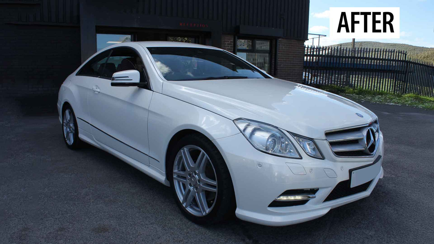 White Mercedes-Benz car, outside Enkahnz, after accident repair. 