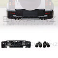 Load image into Gallery viewer, Zoomed in rear shot of Land Rover Defender 110 L663 with additional LM front spoiler and DRL lights, on a faded car, to reveal kit on a white background
