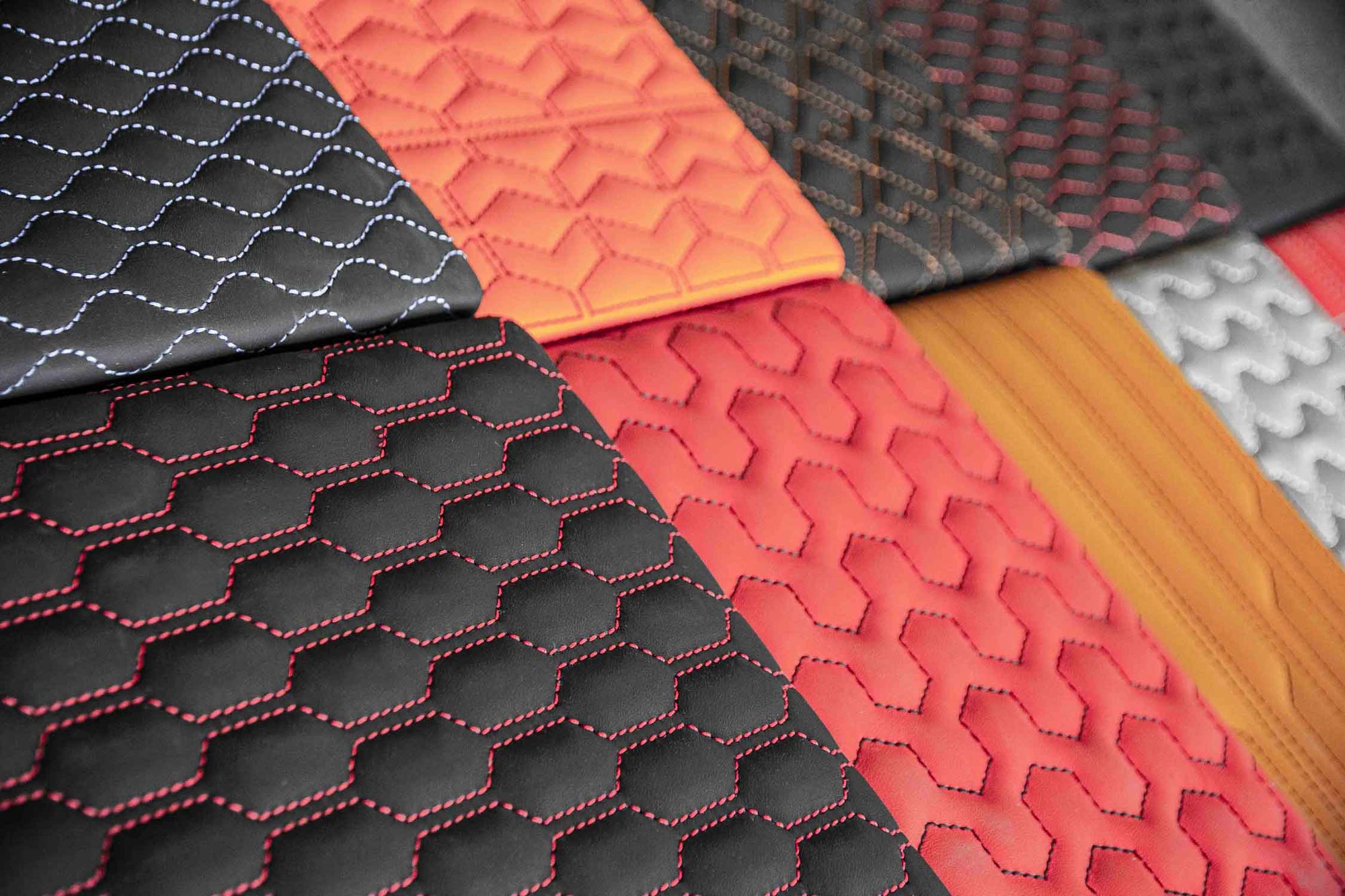 Collection of textured fabric samples in various colours. Barugzai interior patterns