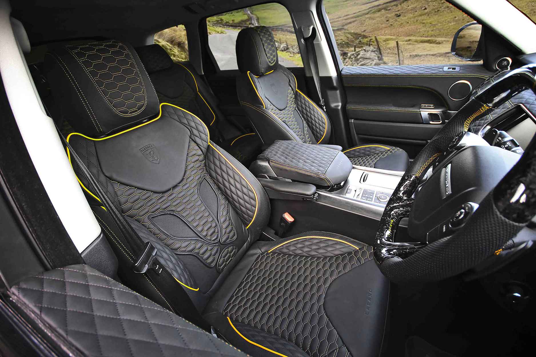 Range Rover Sport L494 Barugzai Wildcat Xpression interior with black quilted seat covers and yellow stitching