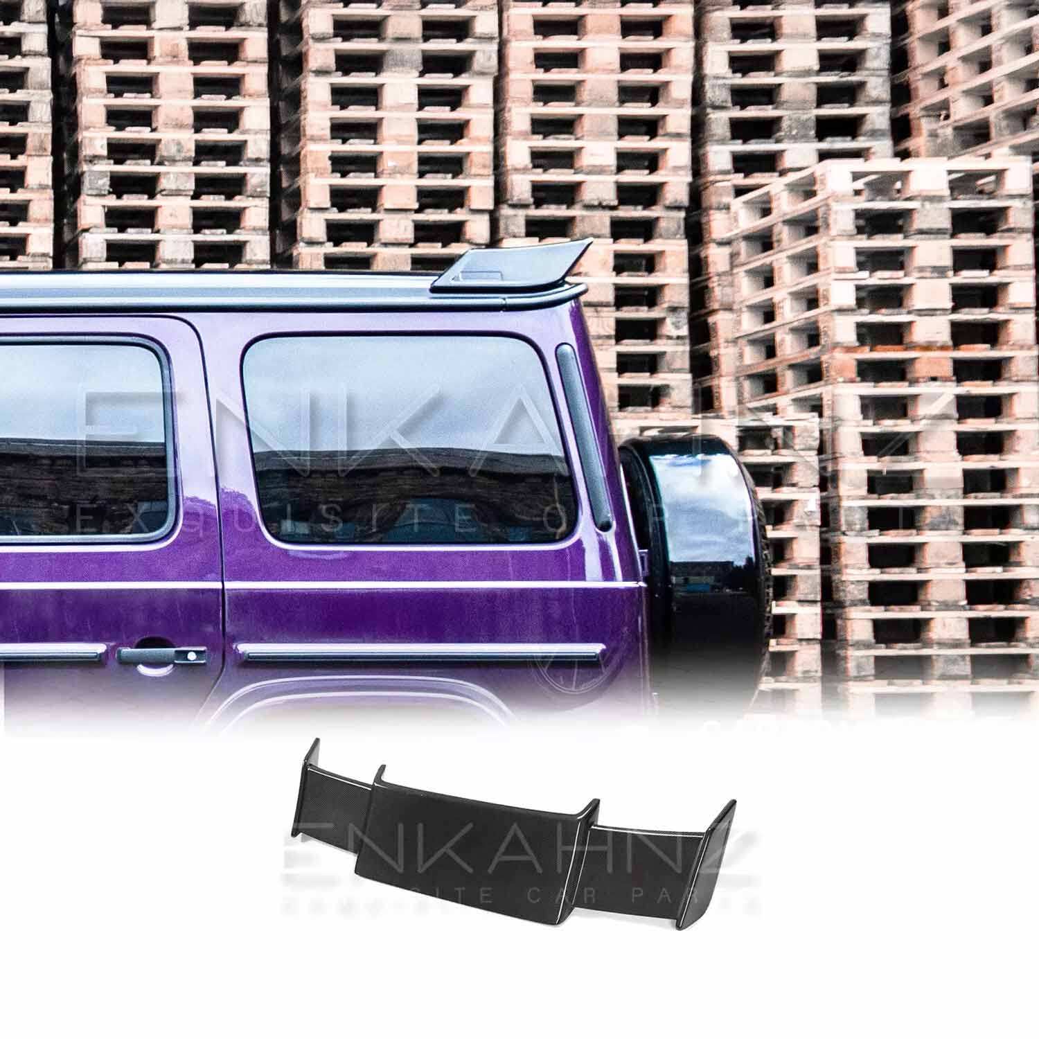 Side view of Purple Mercedes G Wagon G Class W463A SUV with gloss black wheels fitted with real Carbon Fibre BRBS style Rear Roof Spoiler in front of stacked pallets