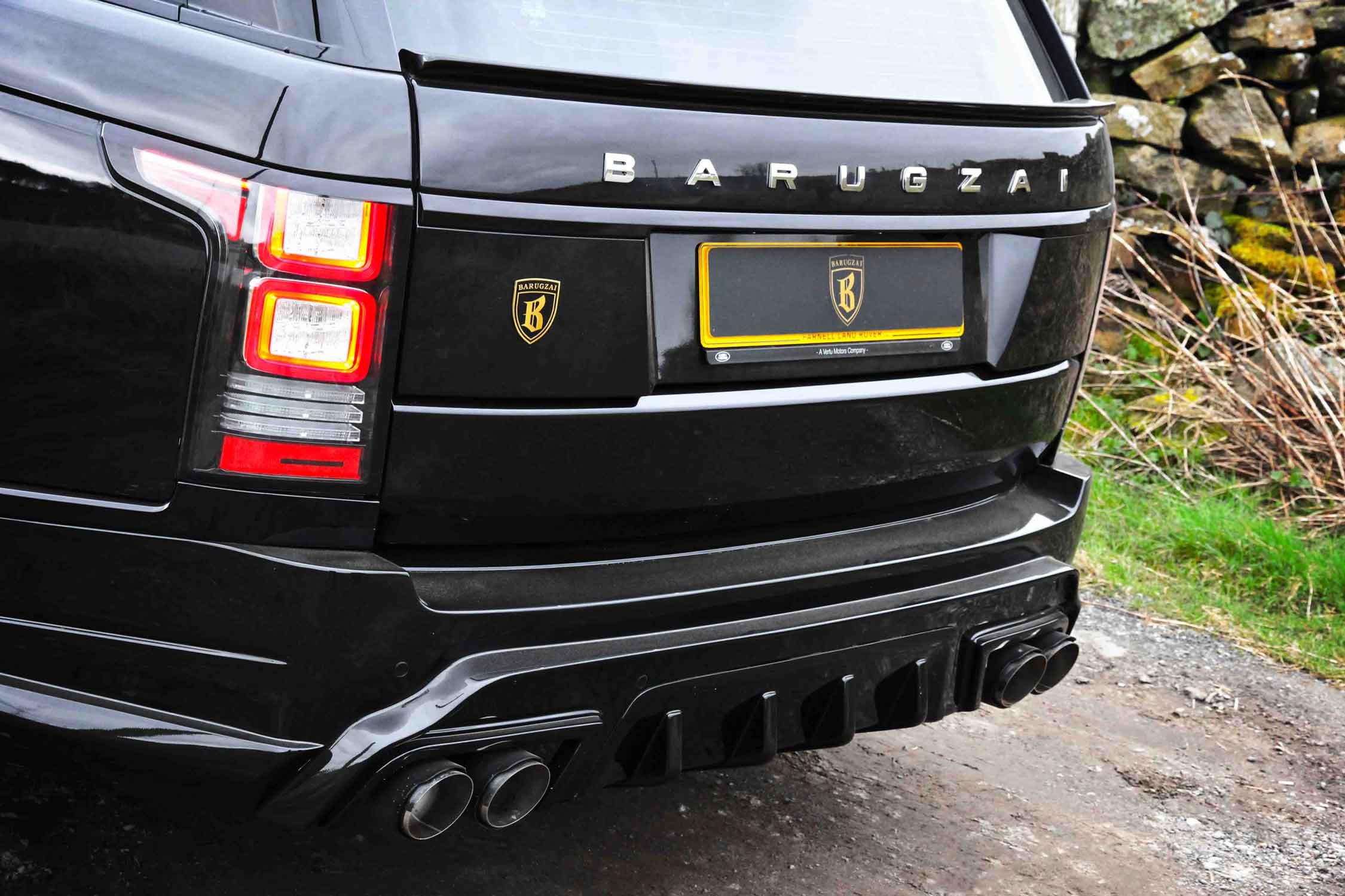 Rear shot of a Range Rover L405, fitted with the Barugzai Vogue Luxe bodykit, shot on in an outdoor setting 