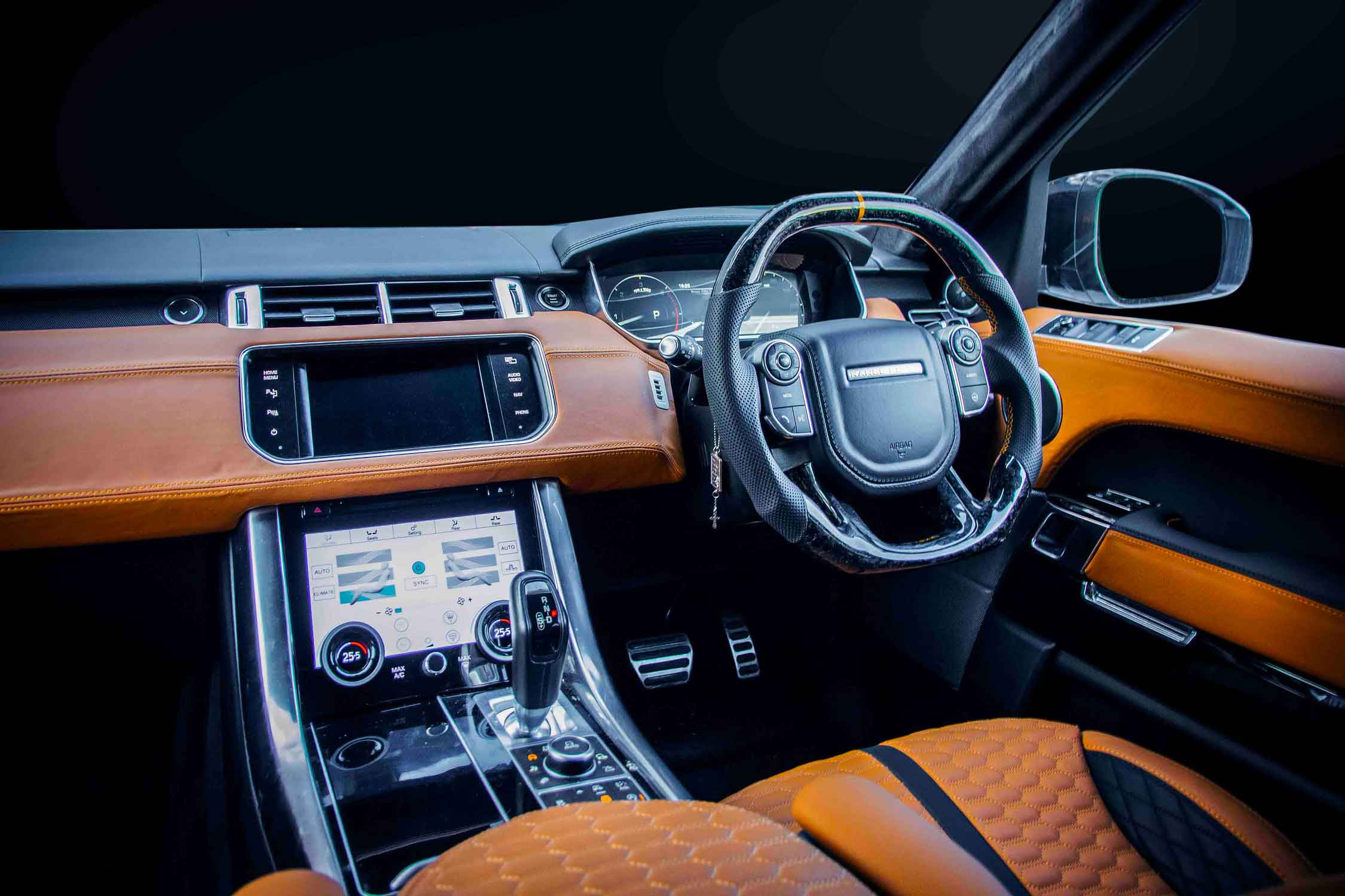 Range Rover Sport L494 interior with Orange re-upholstered dashboard and leather seats with black trim