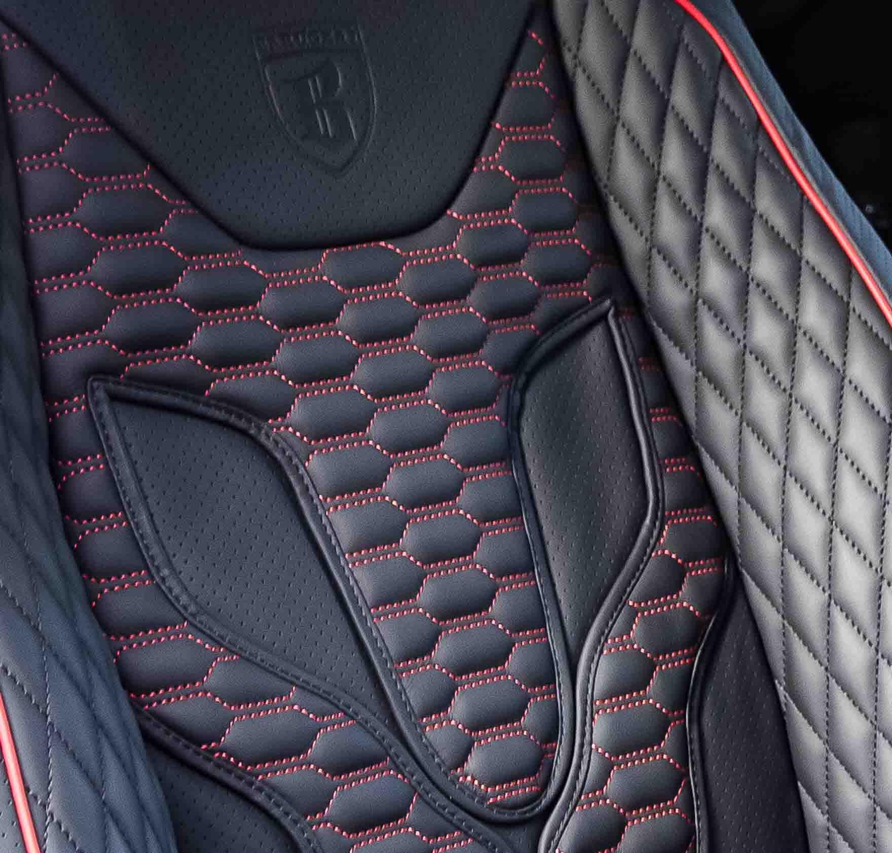 Close-up of a Barugzai Xpression Wildcat seat with quilted design and Barugzai logo in a Range Rover L405, black leather, red stitching